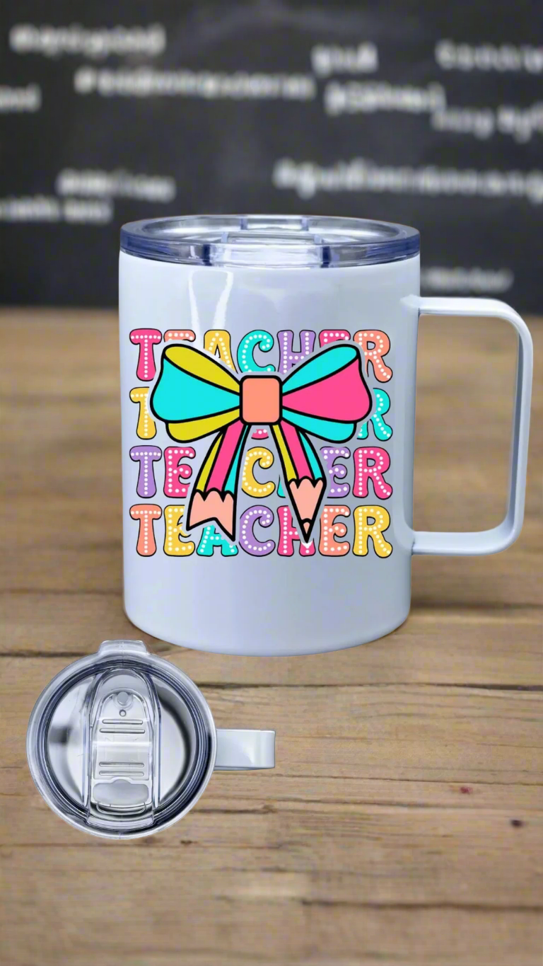 White coffee tumbler with colorful 'Teacher' design on a white background.