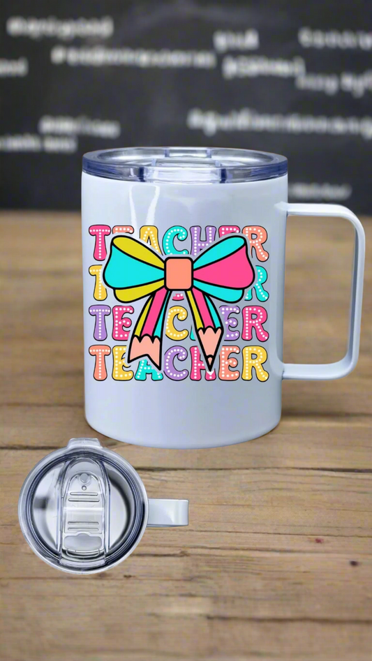 White coffee tumbler with colorful 'Teacher' design on a white background. 