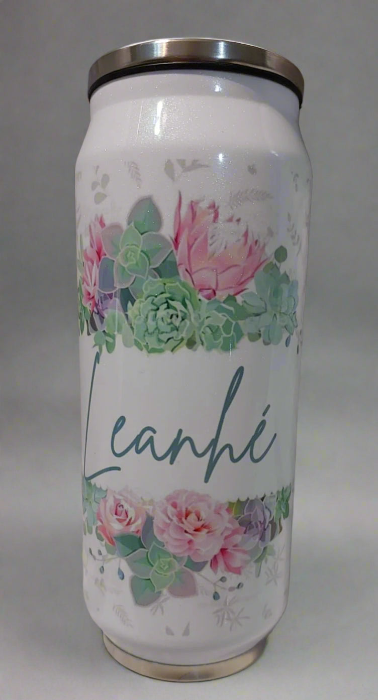 White can with floral design and 'Leah' branding on a textured surface.