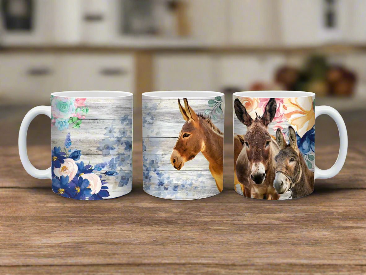 Three mugs with different designs of donkeys and floral patterns on a white background.