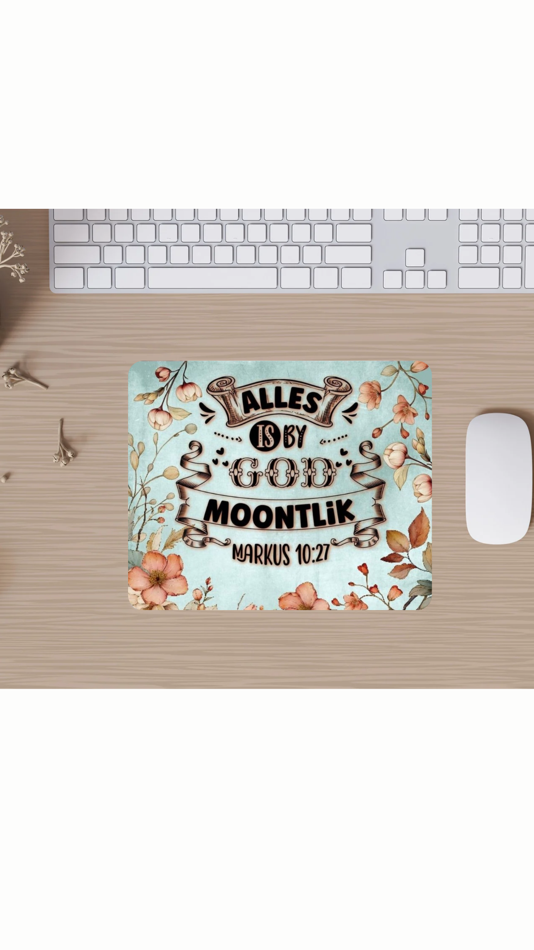 Desk with a mouse pad featuring text and floral design on a desk setup.