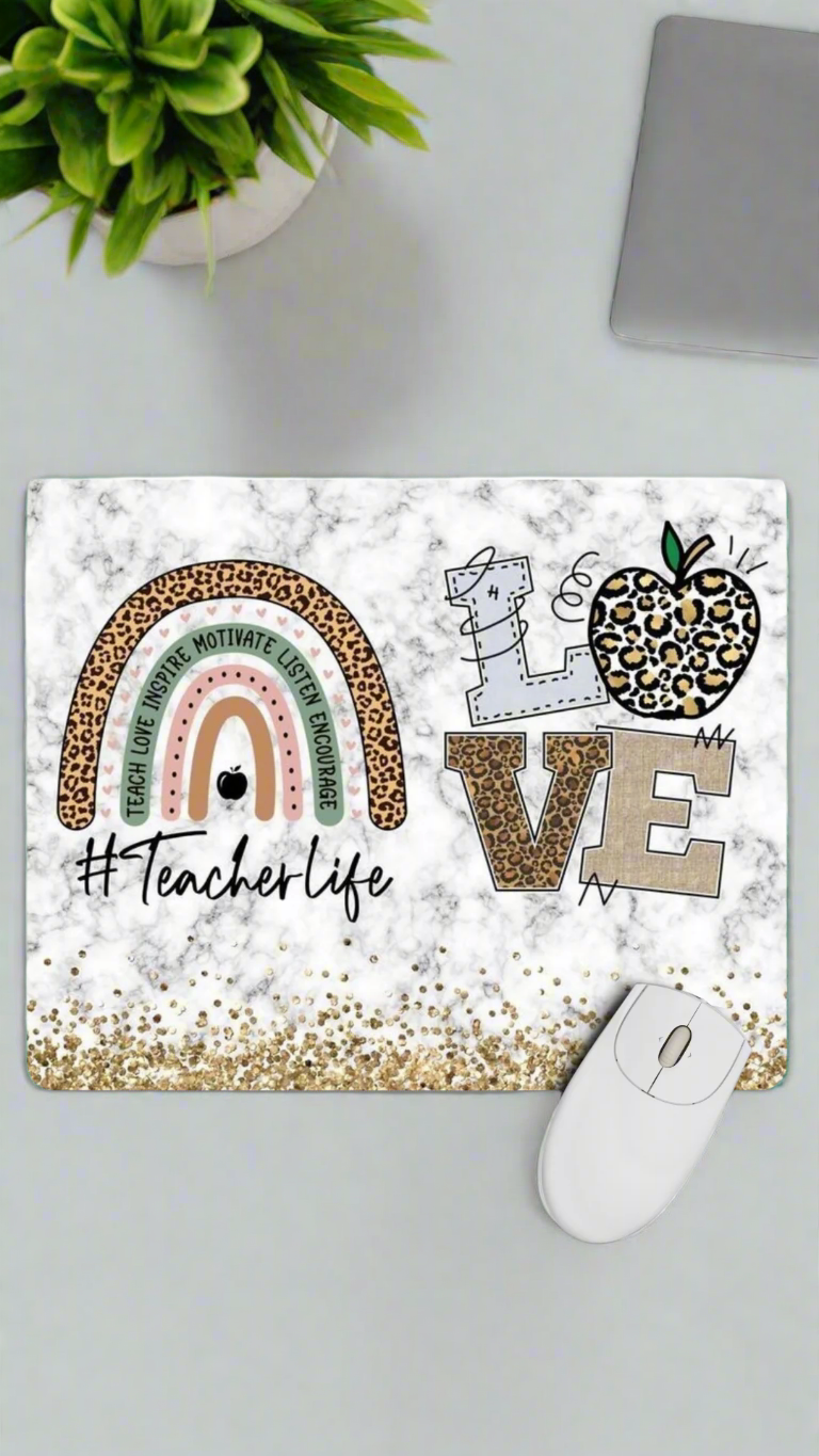 Decorative mouse pad with '#Teacherlife' text and colorful design on a white background