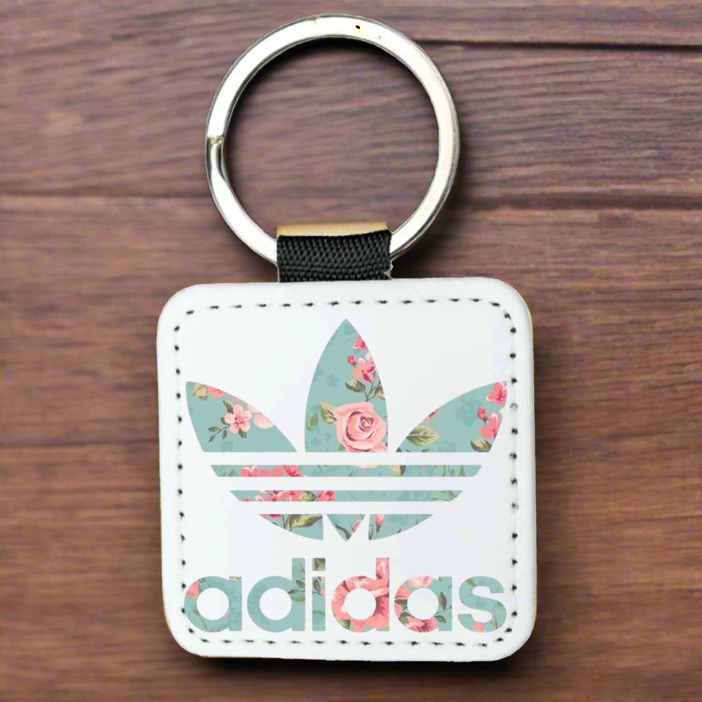 Floral Adidas keychain on a white background