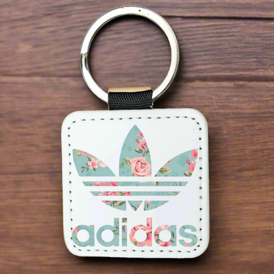 Floral Adidas keychain on a white background