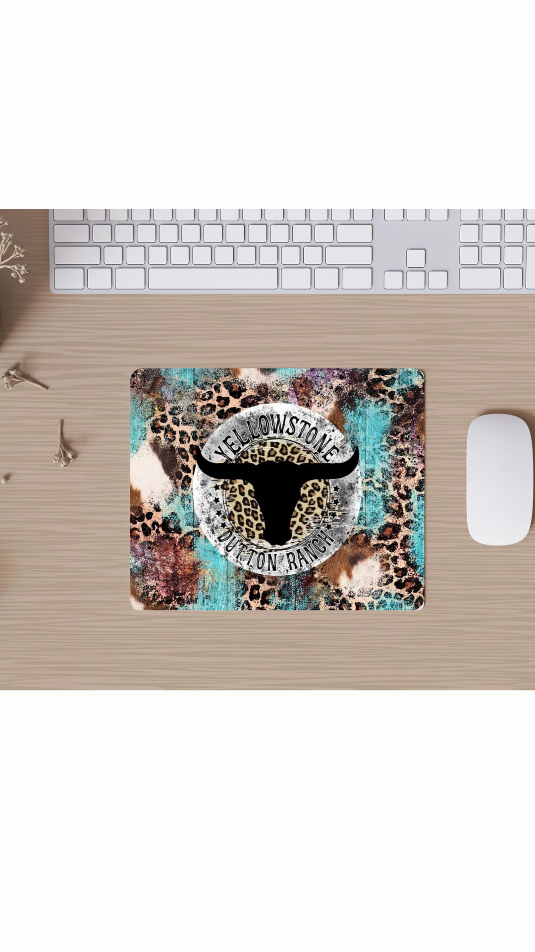 Mouse pad with a leopard print design featuring a logo on a desk with a keyboard and mouse.